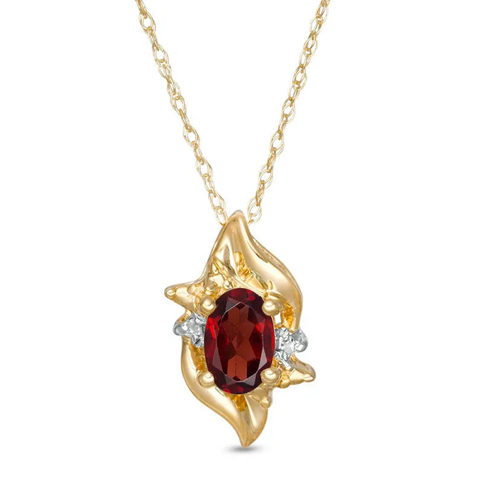 Goldia Necklaces Oval LabCreated Garnet and Diamond Accent Flame Burst Pendant in 10K Yellow Gold Goldia Necklaces Oval LabCreated Garnet and Diamond Accent Flame Burst Pendant in 10K Yellow Gold
